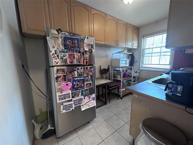 224-43A 64th Ave Unit 43A/545, Oakland Gardens, NY 11364 - kitchen with light tile patterned floors, freestanding refrigerator, light countertops, and light brown cabinetry