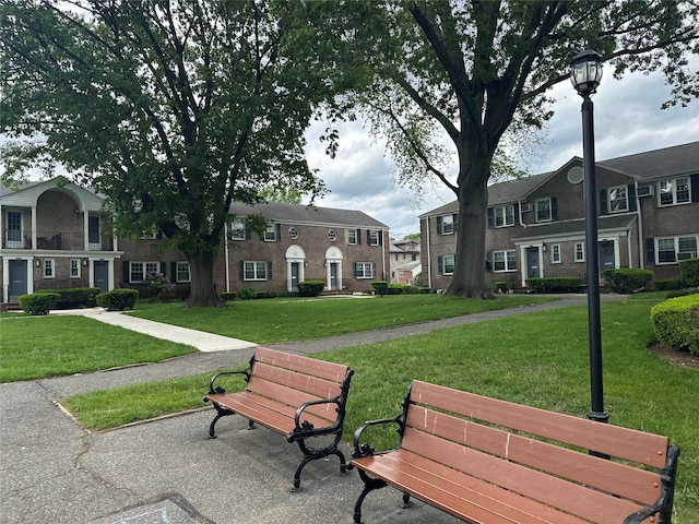 224-43A 64th Ave Unit 43A/545, Oakland Gardens, NY 11364 - view of community featuring a yard and a residential view