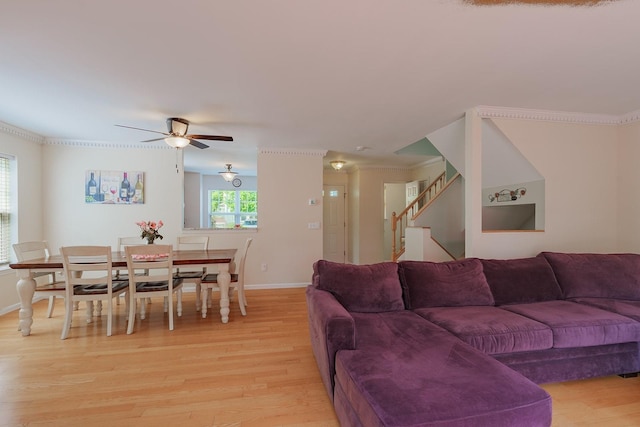 421 Cornwall Meadows Ln, Patterson, NY 12563 - living area with light wood-style floors, a ceiling fan, baseboards, stairway, and crown molding