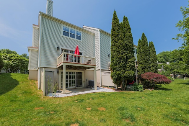 421 Cornwall Meadows Ln, Patterson, NY 12563 - back of property with a yard, a patio, a chimney, and central AC unit