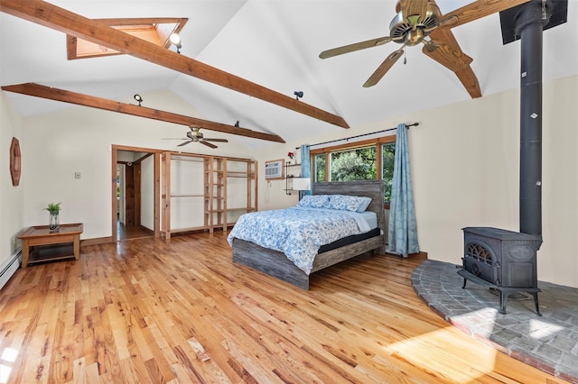 23 Johnson Ln, Millbrook, NY 12545 - bedroom featuring a wood stove and light wood-type flooring