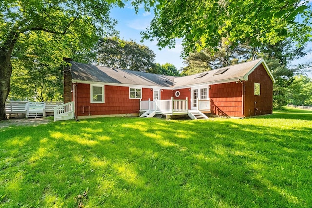 23 Johnson Ln, Millbrook, NY 12545 - back of property featuring a deck, a yard, and a chimney