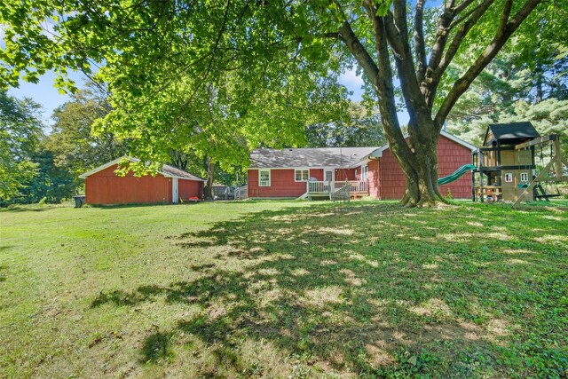 23 Johnson Ln, Millbrook, NY 12545 - view of grassy yard featuring a playground and an outbuilding