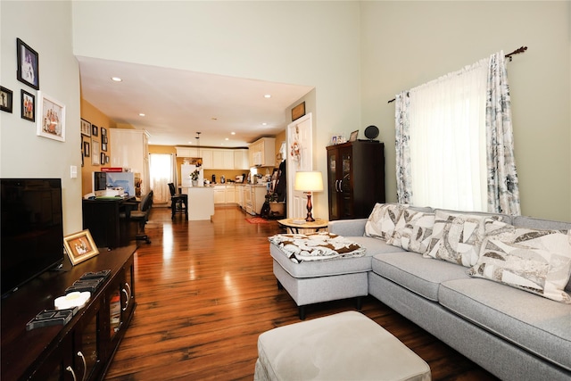 33 Highview Ln, Ridge, NY 11961 - living room with dark wood-style floors, a high ceiling, and recessed lighting
