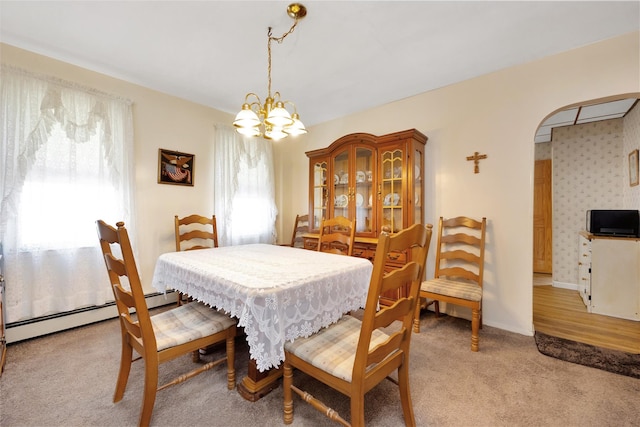 13325 120th St, South Ozone Park, NY 11420 - dining area with plenty of natural light, arched walkways, a chandelier, and light carpet