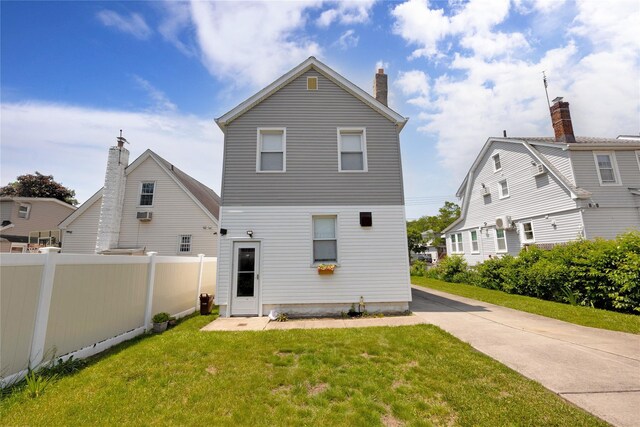 13325 120th St, South Ozone Park, NY 11420 - rear view of property with a chimney