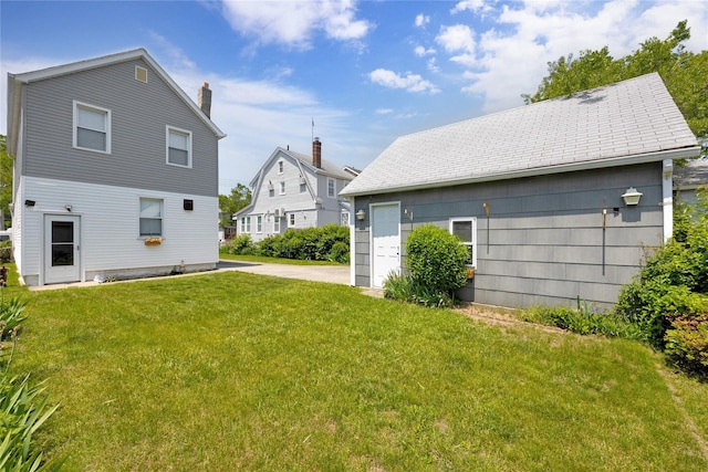 13325 120th St, South Ozone Park, NY 11420 - back of house featuring a lawn
