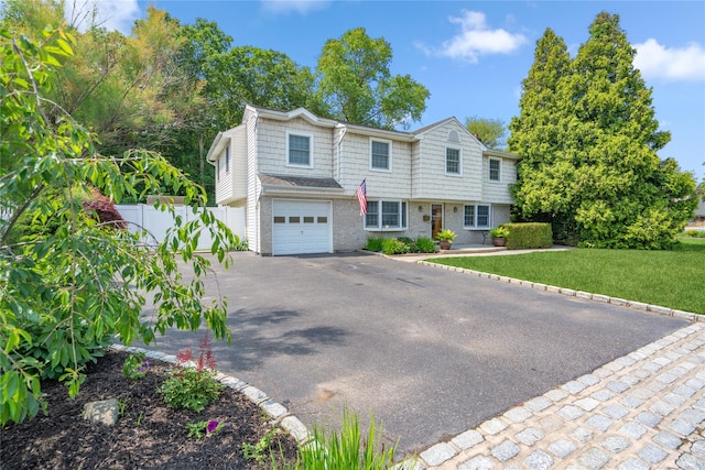 36 Richmond St, Islip, NY 11751 - view of front facade featuring driveway, an attached garage, and brick siding