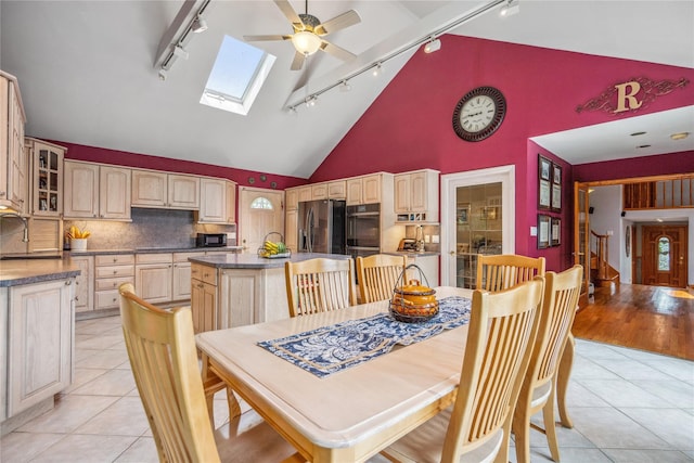 36 Richmond St, Islip, NY 11751 - dining area featuring track lighting, light tile patterned floors, ceiling fan, and high vaulted ceiling
