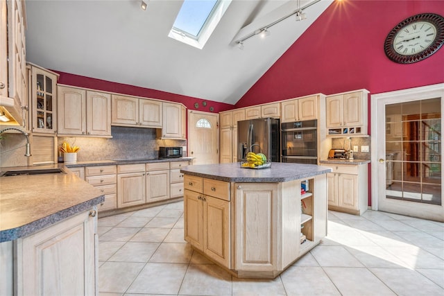 36 Richmond St, Islip, NY 11751 - kitchen with light brown cabinetry, track lighting, black appliances, a skylight, and backsplash