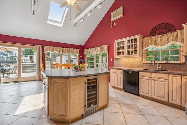 36 Richmond St, Islip, NY 11751 - kitchen featuring beverage cooler, dishwasher, track lighting, high vaulted ceiling, and dark countertops