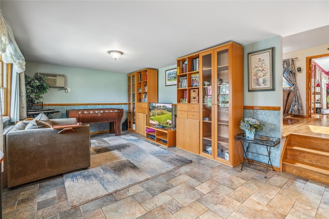 36 Richmond St, Islip, NY 11751 - living room featuring stone finish flooring and a wall mounted air conditioner