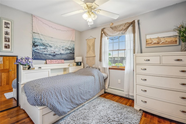 36 Richmond St, Islip, NY 11751 - bedroom with wood finished floors, a ceiling fan, and a baseboard heating unit