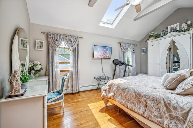 36 Richmond St, Islip, NY 11751 - bedroom featuring baseboard heating, a skylight, light wood-type flooring, ceiling fan, and high vaulted ceiling