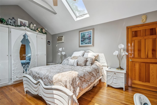36 Richmond St, Islip, NY 11751 - bedroom with lofted ceiling, light wood-style floors, a skylight, a closet, and a wall mounted air conditioner