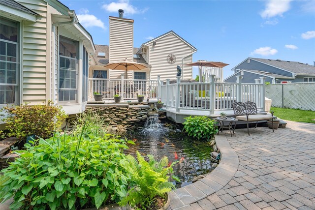 36 Richmond St, Islip, NY 11751 - view of patio / terrace with a garden pond and a deck