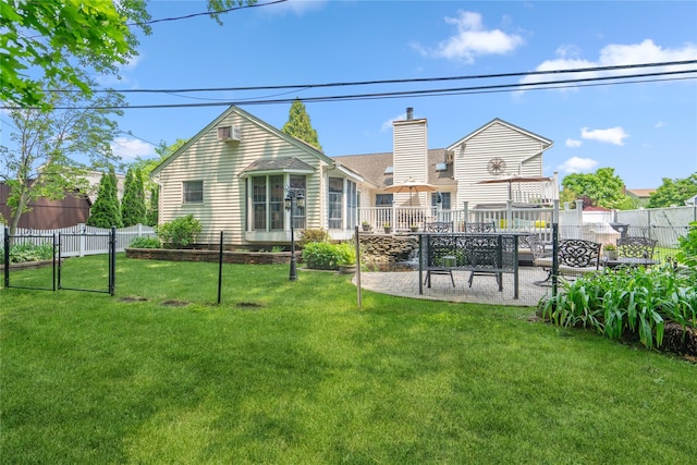 36 Richmond St, Islip, NY 11751 - back of property featuring a patio and a chimney