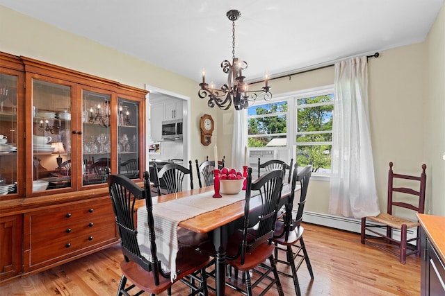 35 Highview Ave, Florida, NY 10921 - dining room featuring a chandelier, a baseboard radiator, and light wood-style floors