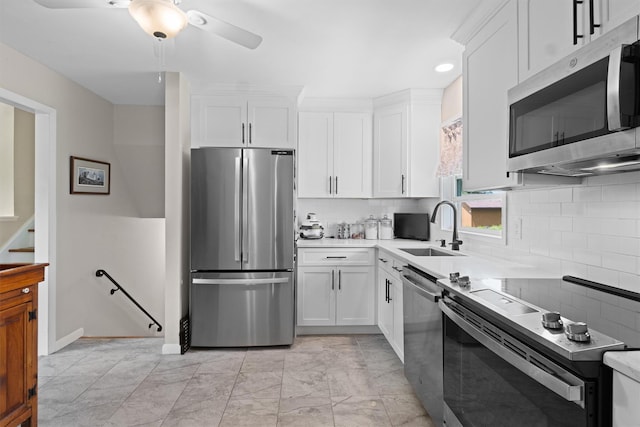 35 Highview Ave, Florida, NY 10921 - kitchen with appliances with stainless steel finishes, white cabinets, light countertops, tasteful backsplash, and recessed lighting