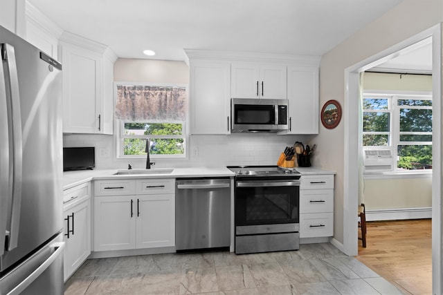 35 Highview Ave, Florida, NY 10921 - kitchen with appliances with stainless steel finishes, a baseboard heating unit, plenty of natural light, white cabinetry, and recessed lighting