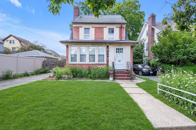 4360 Auburndale Ln, Flushing, NY 11358 - view of front facade with brick siding and a chimney