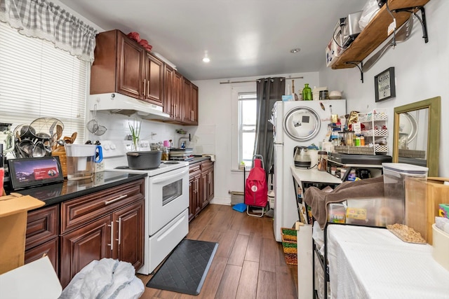 4360 Auburndale Ln, Flushing, NY 11358 - kitchen featuring white range with electric stovetop, under cabinet range hood, wood finished floors, recessed lighting, and dark countertops