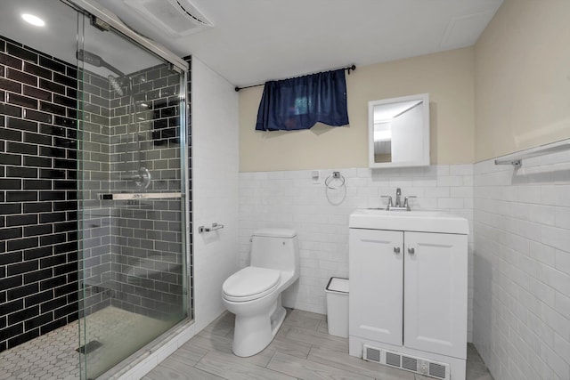 4360 Auburndale Ln, Flushing, NY 11358 - bathroom with tile walls, a stall shower, vanity, and a wainscoted wall