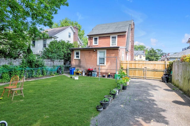 4360 Auburndale Ln, Flushing, NY 11358 - rear view of house featuring brick siding and a fenced backyard