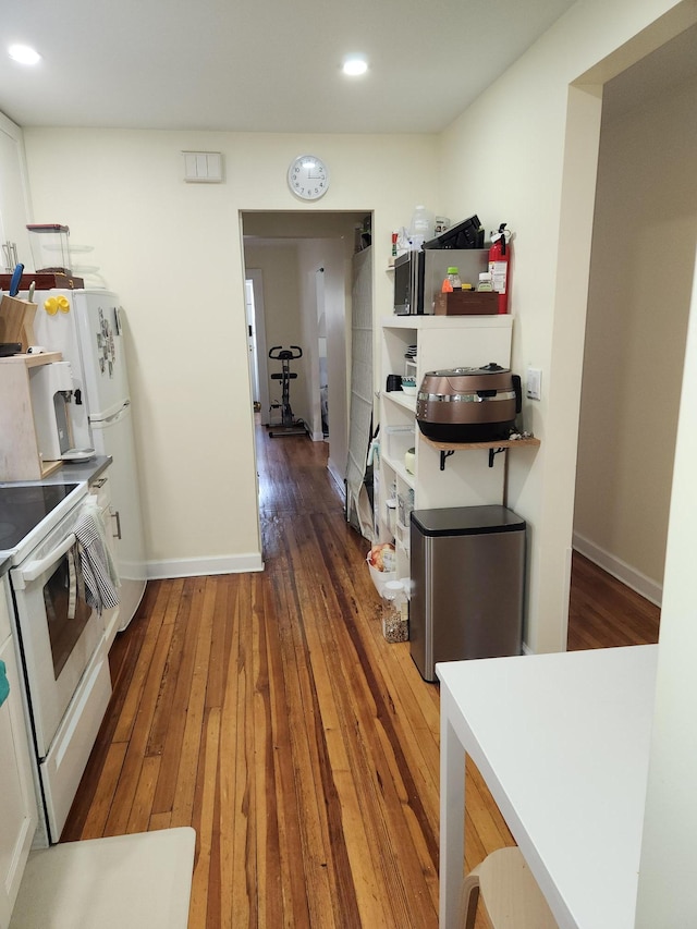 4360 Auburndale Ln, Flushing, NY 11358 - kitchen featuring white electric stove, wood-type flooring, and recessed lighting