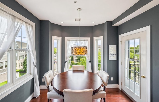 494 Pacing Way Unit 301C, Westbury, NY 11590 - dining area featuring baseboards, healthy amount of natural light, dark wood-style floors, and recessed lighting