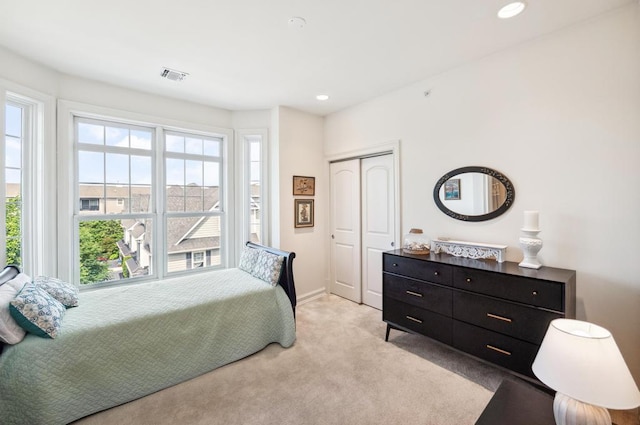 494 Pacing Way Unit 301C, Westbury, NY 11590 - bedroom featuring light carpet, a closet, recessed lighting, and baseboards