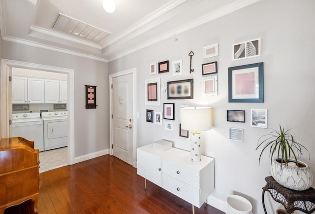 494 Pacing Way Unit 301C, Westbury, NY 11590 - corridor with washer and clothes dryer, dark wood-type flooring, baseboards, crown molding, and a raised ceiling
