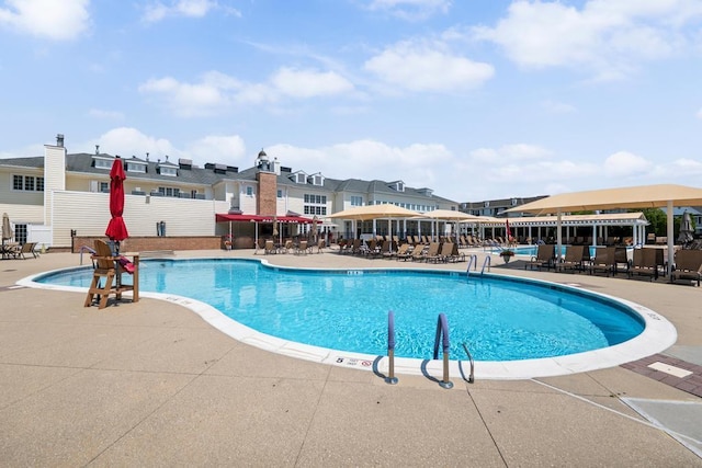 494 Pacing Way Unit 301C, Westbury, NY 11590 - community pool with a patio area and a residential view