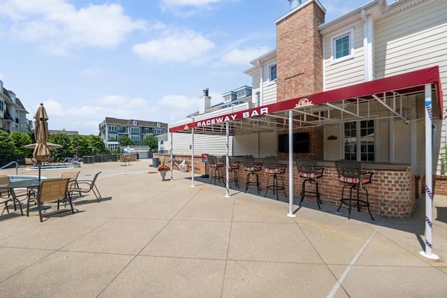 494 Pacing Way Unit 301C, Westbury, NY 11590 - view of patio / terrace featuring an outdoor bar
