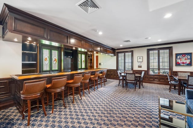 494 Pacing Way Unit 301C, Westbury, NY 11590 - indoor dry bar with ornamental molding, recessed lighting, wainscoting, a decorative wall, and carpet floors