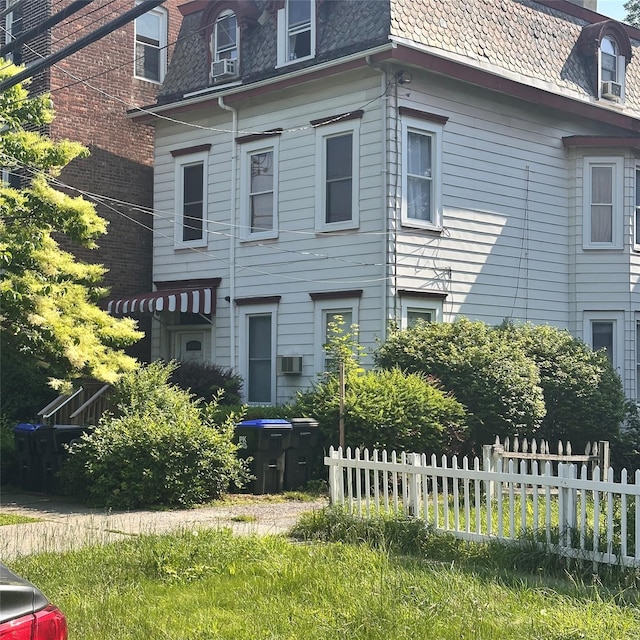 86 S Hamilton St, Poughkeepsie, NY 12601 - view of home's exterior with mansard roof and cooling unit
