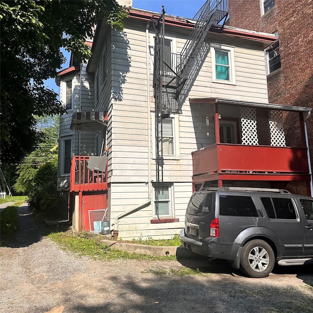 86 S Hamilton St, Poughkeepsie, NY 12601 - view of property exterior with a balcony and a chimney
