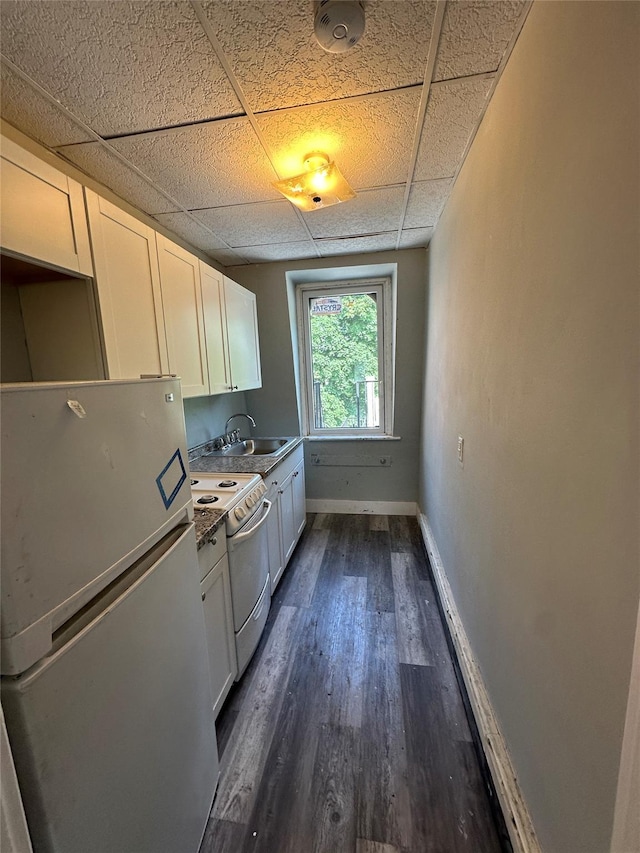 86 S Hamilton St, Poughkeepsie, NY 12601 - kitchen with freestanding refrigerator, electric range, a sink, a drop ceiling, and baseboards