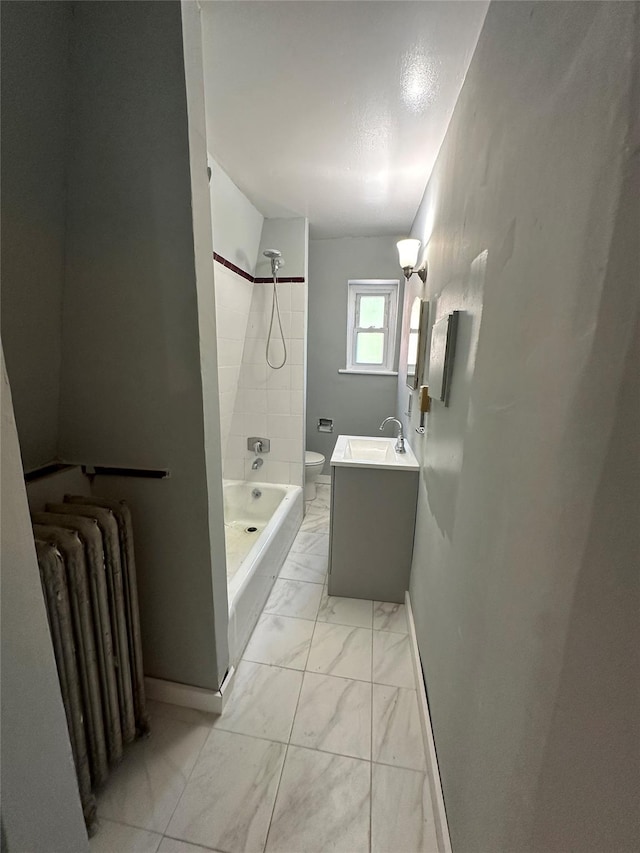 86 S Hamilton St, Poughkeepsie, NY 12601 - full bath with radiator, toilet, marble finish floors, vanity, and  shower combination