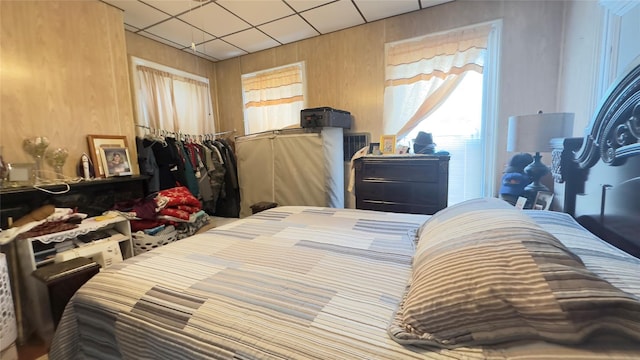 86 S Hamilton St, Poughkeepsie, NY 12601 - bedroom featuring a drop ceiling, a closet, and wood walls