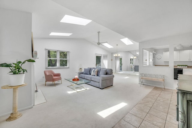 195 Alicia Dr Unit 195, North Babylon, NY 11703 - living area featuring a skylight, vaulted ceiling, light carpet, and light tile patterned floors