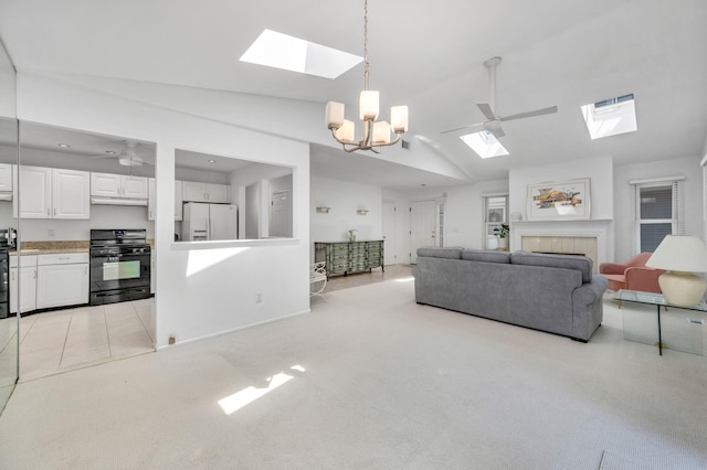 195 Alicia Dr Unit 195, North Babylon, NY 11703 - living area with a skylight, high vaulted ceiling, a fireplace, and a chandelier