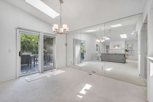 195 Alicia Dr Unit 195, North Babylon, NY 11703 - dining space featuring a chandelier, a skylight, carpet, plenty of natural light, and high vaulted ceiling
