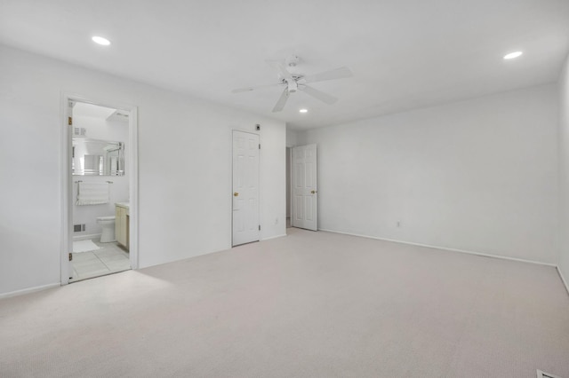 195 Alicia Dr Unit 195, North Babylon, NY 11703 - unfurnished bedroom with light carpet, recessed lighting, connected bathroom, and ceiling fan