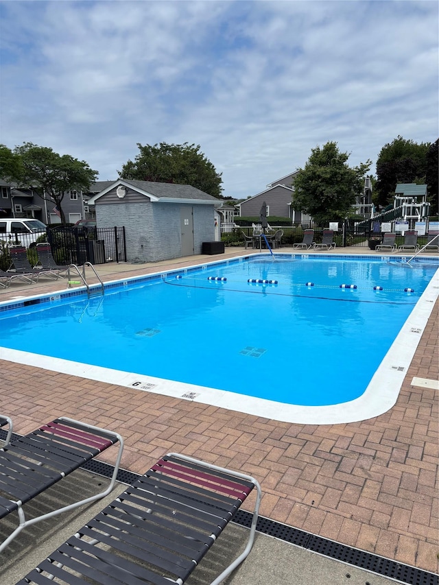 195 Alicia Dr Unit 195, North Babylon, NY 11703 - community pool with a patio and a residential view