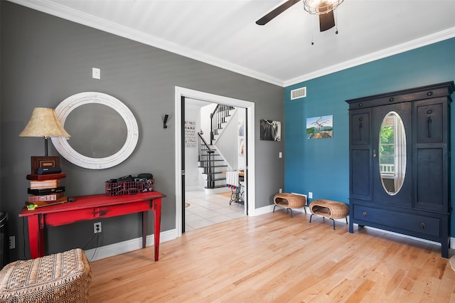 446 M And M Rd, Middletown, NY 10940 - foyer entrance with baseboards, crown molding, stairway, a ceiling fan, and wood finished floors