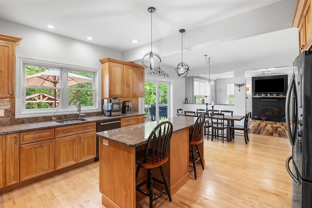 446 M And M Rd, Middletown, NY 10940 - kitchen with a sink, freestanding refrigerator, a kitchen island, dishwashing machine, and light wood-style flooring