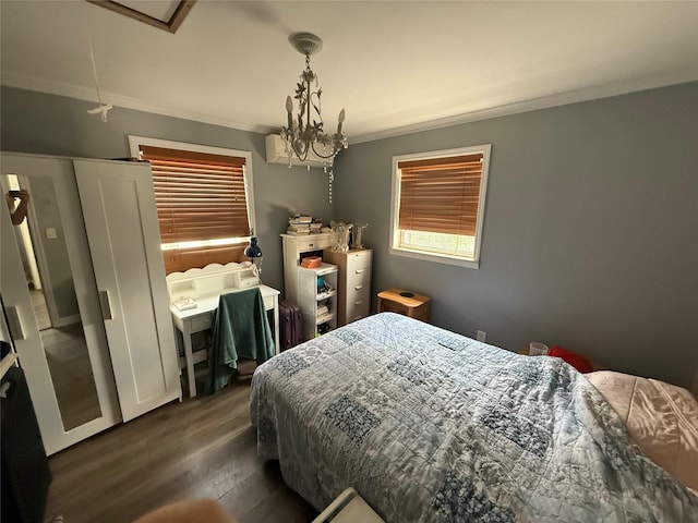 7308 187th St, Fresh Meadows, NY 11366 - bedroom with ornamental molding, dark wood-style flooring, and a chandelier