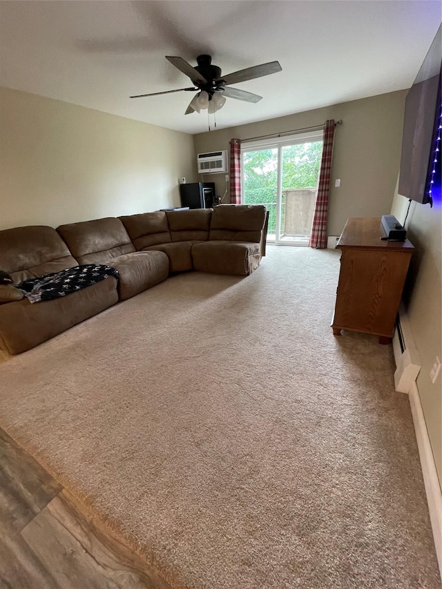 701 Towne House Vlg Unit 701, Hauppauge, NY 11749 - living area with carpet floors, a wall mounted AC, and a ceiling fan