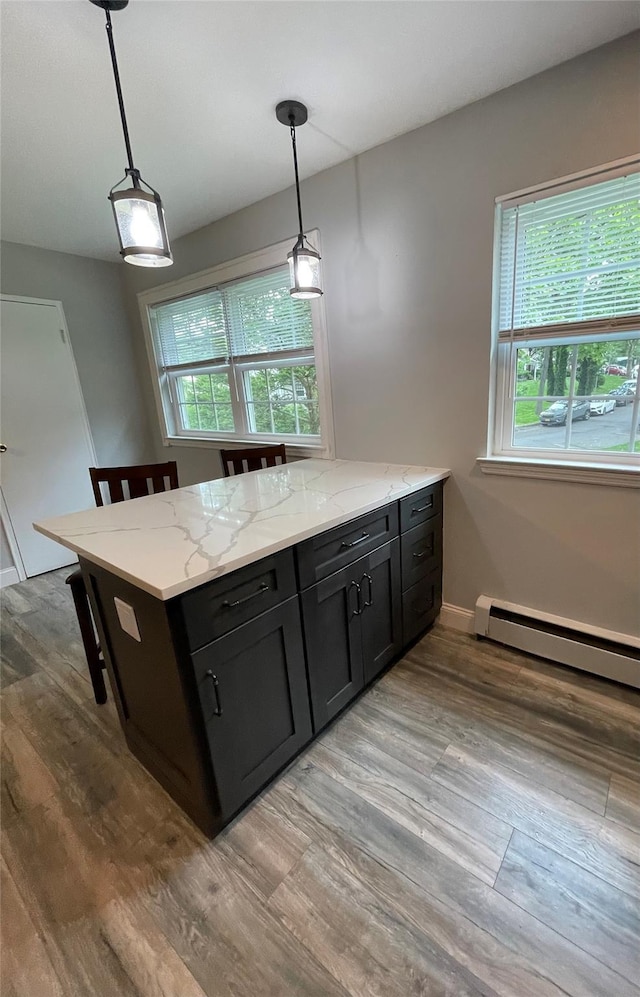 701 Towne House Vlg Unit 701, Hauppauge, NY 11749 - kitchen with a baseboard radiator, plenty of natural light, and pendant lighting